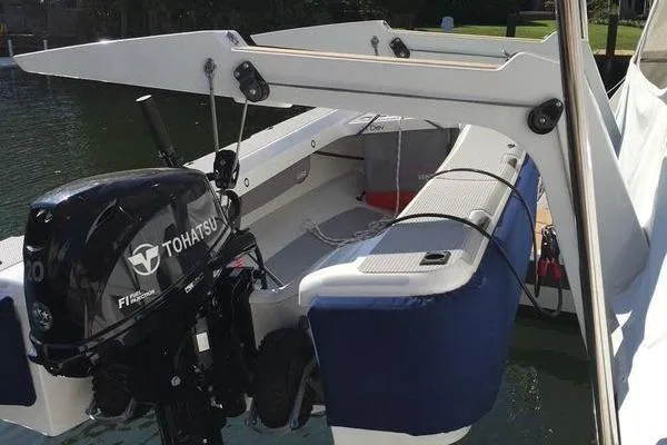 Endeavour Yacht Photos Pics 2020 Fountaine Pajot Saona 47 with Tohatsu outboard motor, docked in a marina.