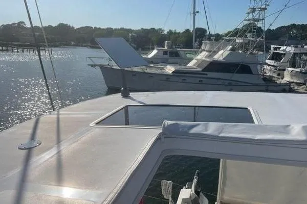 Endeavour Yacht Photos Pics 2020 Fountaine Pajot Saona 47 catamaran docked in a sunny marina.