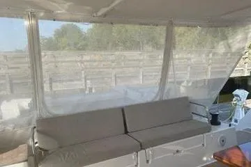 Endeavour Yacht Photos Pics 2020 Fountaine Pajot Saona 47 yacht interior with comfortable seating and outdoor view.