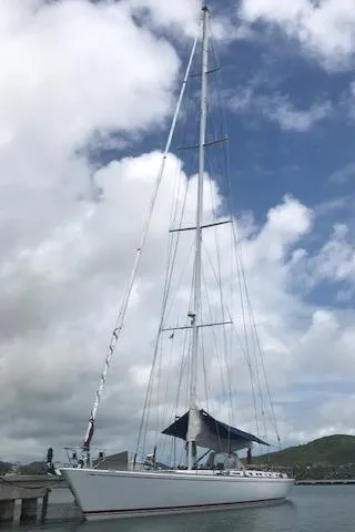 Josefina Yacht Photos Pics Sailing yacht Nautor Swan 86, 1989 model, docked under a cloudy sky.