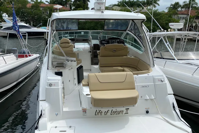 Life Of Leisure II Yacht Photos Pics 2013 Cruisers Yachts 380 Express docked, featuring spacious seating and elegant design.
