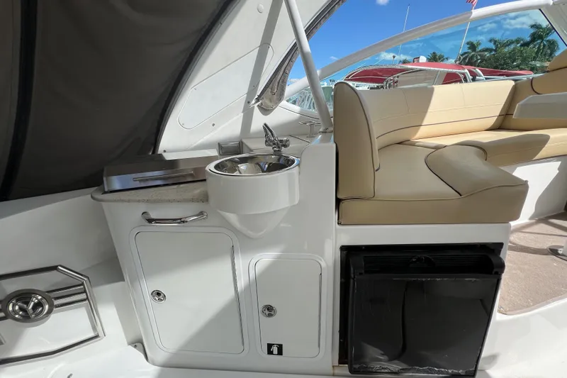 Life Of Leisure II Yacht Photos Pics 2013 Cruisers Yachts 380 Express interior with sink, seating, and storage.