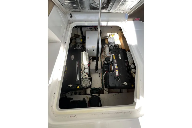Life Of Leisure II Yacht Photos Pics Engine compartment of a 2013 Cruisers Yachts 380 Express, showcasing dual engines.