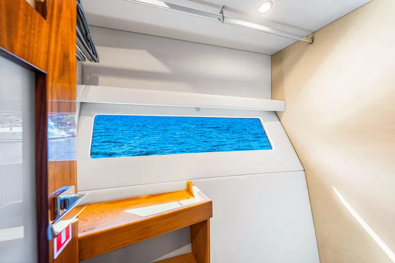  Yacht Photos Pics Interior view of 2022 Riviera 505 SUV yacht with ocean view window.