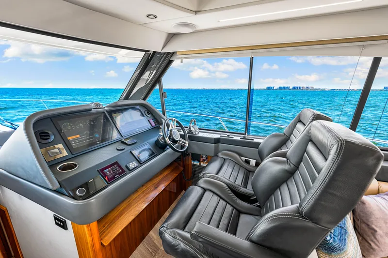  Yacht Photos Pics Interior of 2022 Riviera 505 SUV yacht with ocean view and modern dashboard.