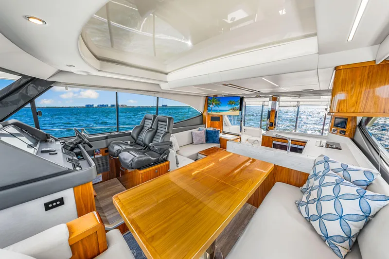  Yacht Photos Pics Luxurious interior of 2022 Riviera 505 SUV yacht with ocean view and modern furnishings.