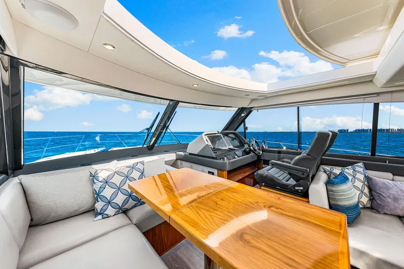  Yacht Photos Pics Luxurious interior of 2022 Riviera 505 SUV yacht with ocean view.