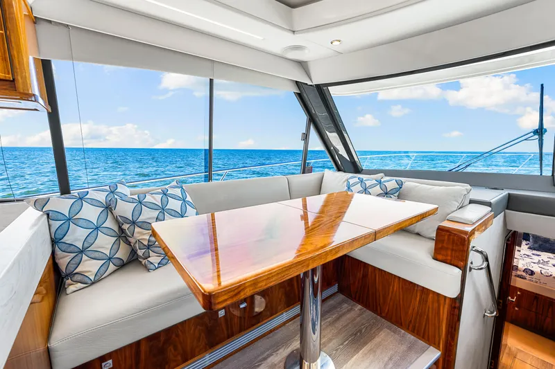  Yacht Photos Pics Luxurious interior of 2022 Riviera 505 SUV yacht with ocean view.