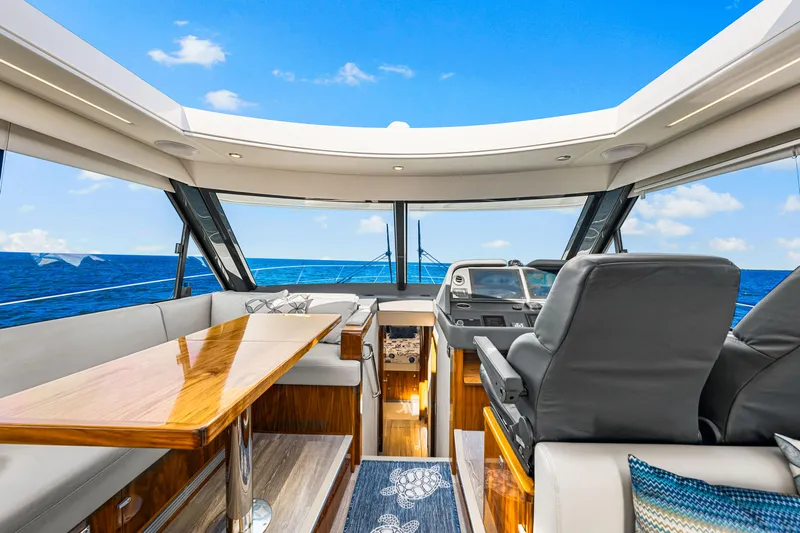  Yacht Photos Pics Interior of 2022 Riviera 505 SUV yacht with ocean view and luxurious seating.