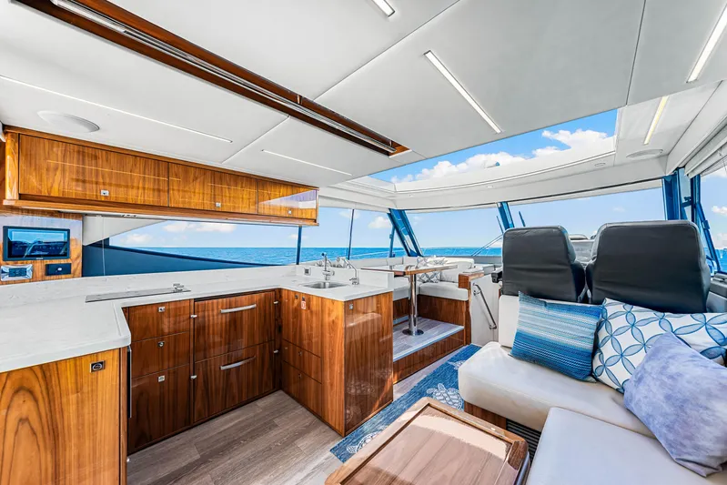  Yacht Photos Pics Luxurious interior of 2022 Riviera 505 SUV yacht with modern design and ocean view.