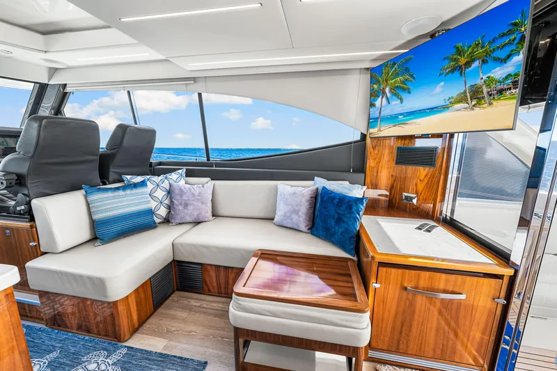  Yacht Photos Pics Luxurious interior of 2022 Riviera 505 SUV yacht with plush seating and ocean view.