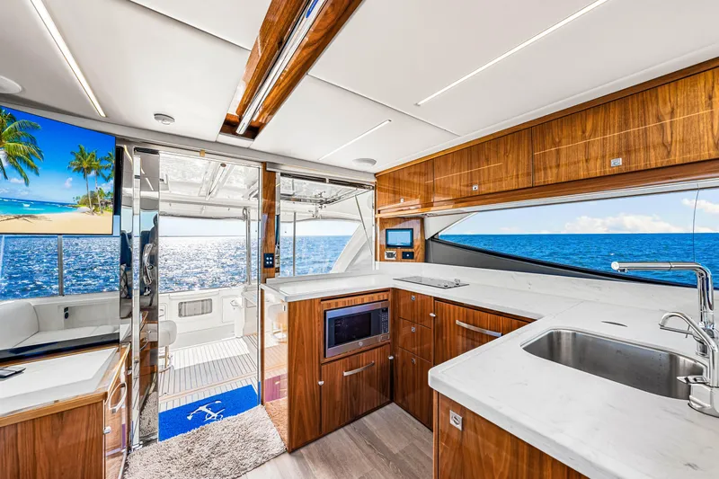  Yacht Photos Pics Interior of 2022 Riviera 505 SUV yacht with ocean view and modern kitchen design.