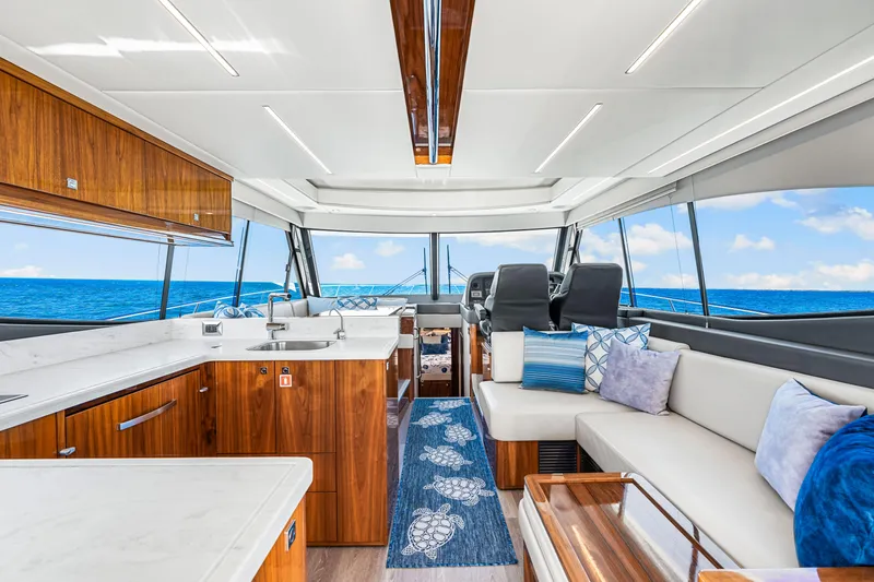  Yacht Photos Pics Luxurious interior of 2022 Riviera 505 SUV yacht with ocean view.