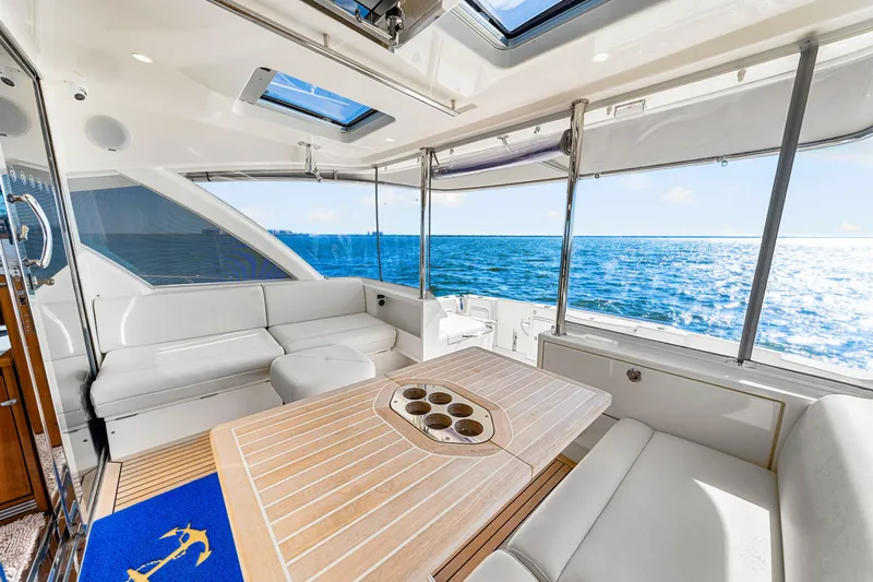  Yacht Photos Pics Luxurious interior of 2022 Riviera 505 SUV yacht with ocean view.