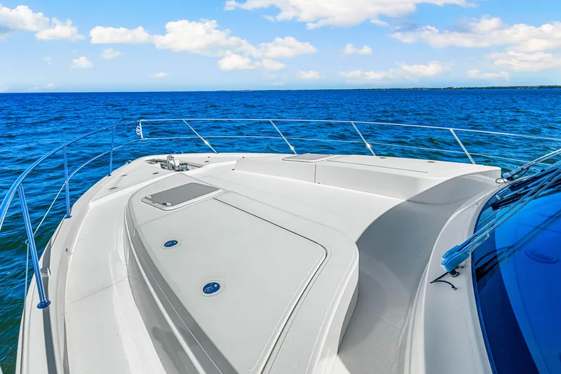  Yacht Photos Pics 2022 Riviera 505 SUV yacht deck with ocean view and clear blue sky.