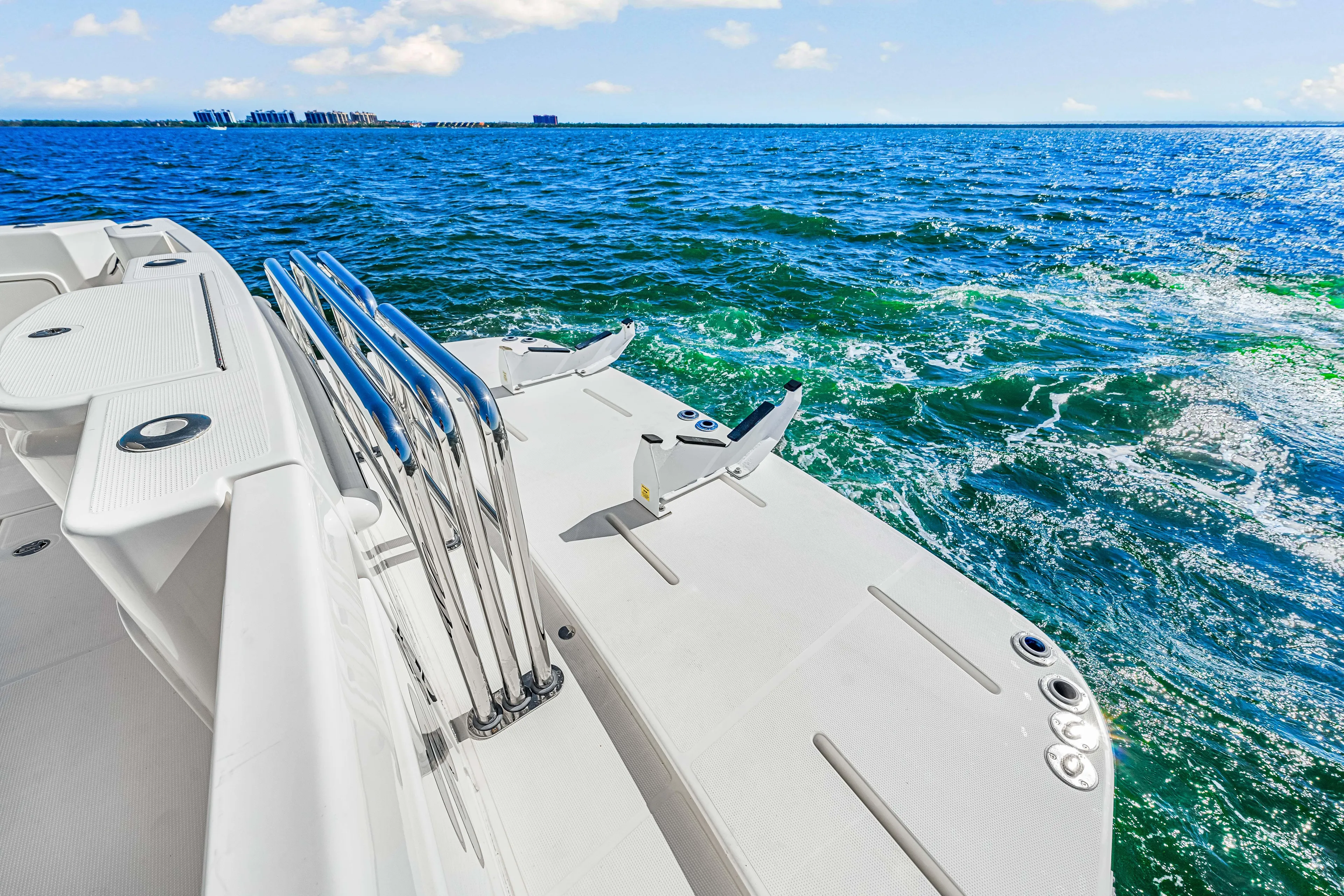  Yacht Photos Pics 2022 Riviera 505 SUV yacht deck overlooking vibrant blue ocean waters.