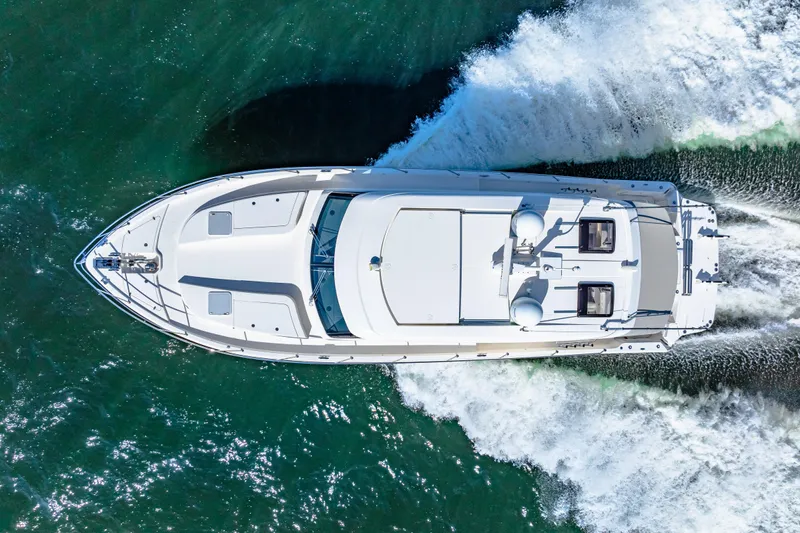  Yacht Photos Pics Aerial view of 2022 Riviera 505 SUV yacht cruising on the ocean.