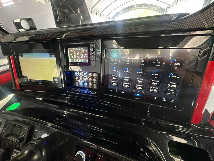  Yacht Photos Pics Dashboard of a 2018 Mystic Powerboats M4200 with advanced navigation and control displays.