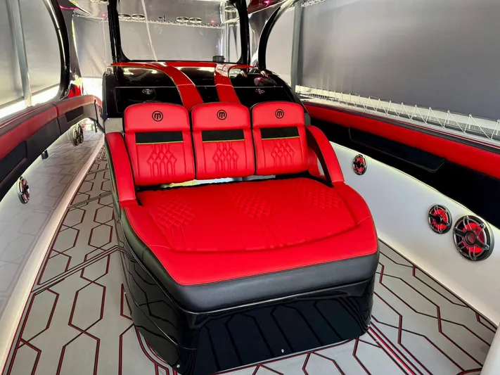  Yacht Photos Pics Luxurious interior of 2018 Mystic Powerboats M4200 with red and black seating.