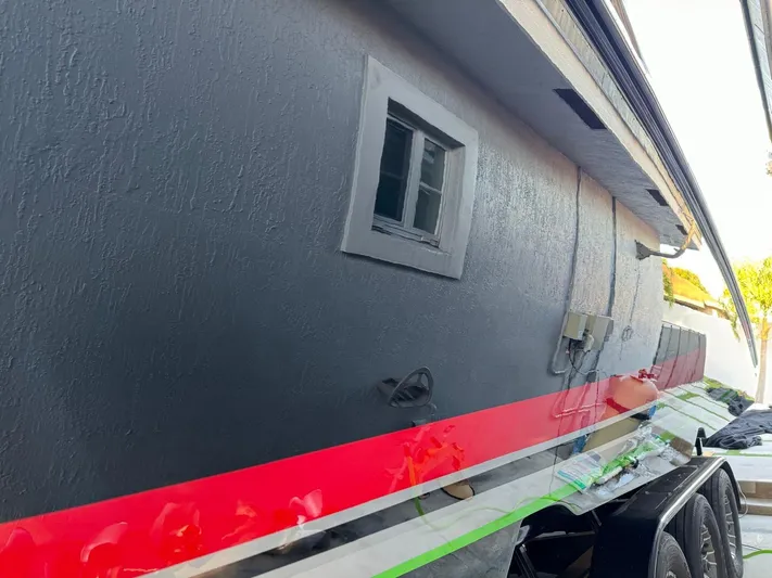  Yacht Photos Pics 2018 Mystic Powerboats M4200 with sleek design and vibrant red stripe detailing.