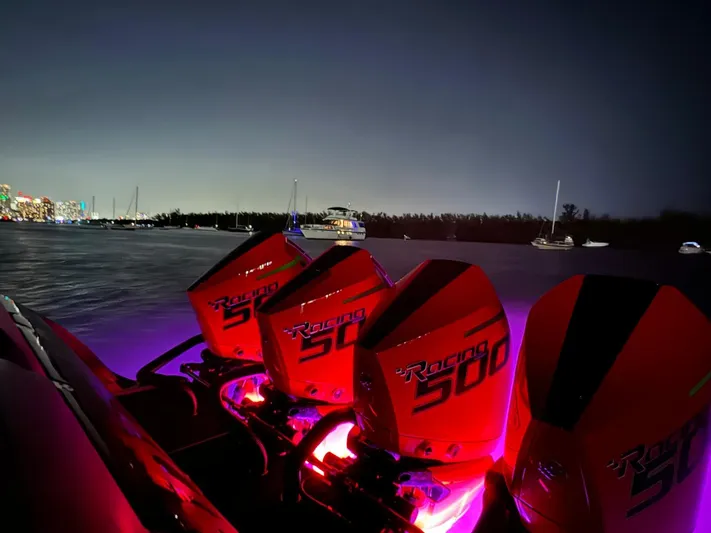  Yacht Photos Pics 2018 Mystic Powerboats M4200 with illuminated Racing 500 engines at night on the water.