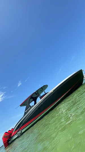  Yacht Photos Pics 2018 Mystic Powerboats M4200 on clear water under a bright blue sky.