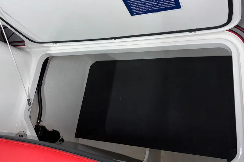  Yacht Photos Pics Storage compartment of a 2018 Mystic Powerboats M4200, featuring a sleek interior design.