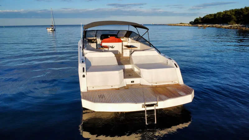 Ischia Yacht Photos Pics 2024 BB Yachts 44 Ischia luxury yacht on calm sea, rear view.