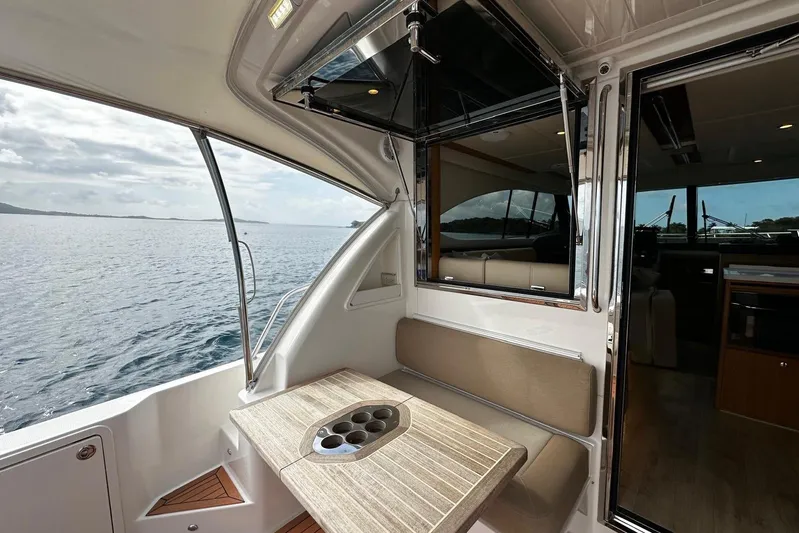  Yacht Photos Pics 2020 Riviera 395 SUV interior with seating and ocean view.