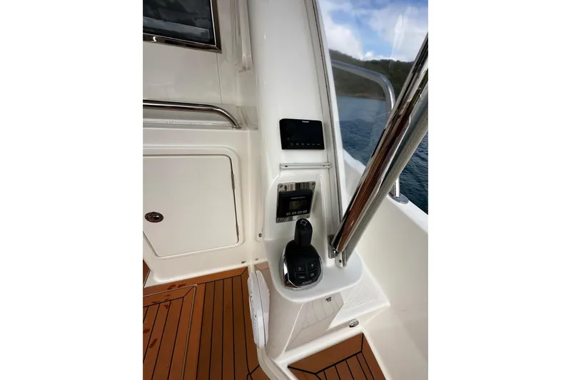  Yacht Photos Pics Control panel of a 2020 Riviera 395 SUV boat with joystick and navigation equipment.