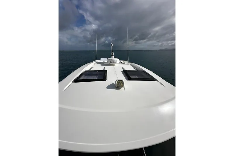  Yacht Photos Pics 2020 Riviera 395 SUV yacht deck with overcast sky and ocean view.