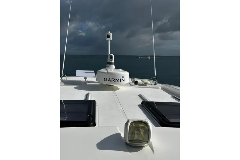  Yacht Photos Pics Riviera 395 SUV 2020 yacht with Garmin equipment on deck, under cloudy sky.