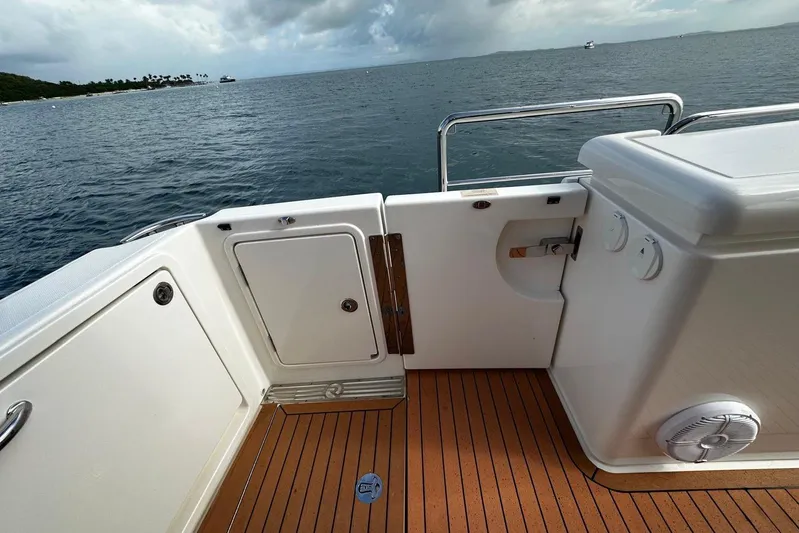  Yacht Photos Pics 2020 Riviera 395 SUV boat deck with ocean view and teak flooring.