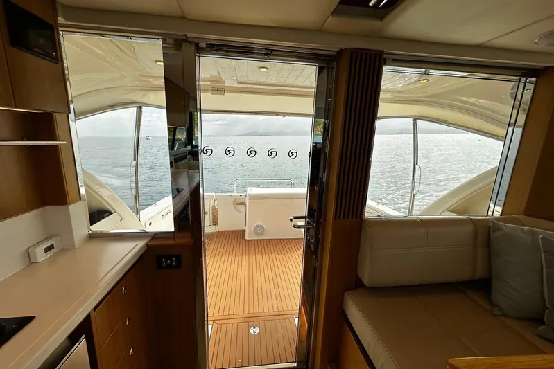  Yacht Photos Pics Interior view of 2020 Riviera 395 SUV yacht with ocean backdrop.