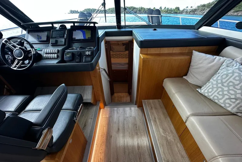  Yacht Photos Pics Interior of 2020 Riviera 395 SUV yacht with modern helm and seating area.