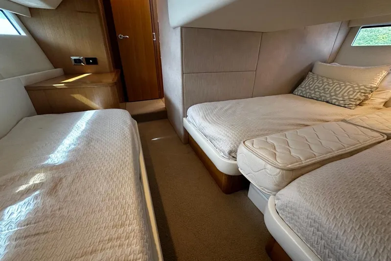  Yacht Photos Pics 2020 Riviera 395 SUV interior cabin with twin beds and modern decor.