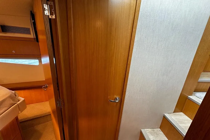  Yacht Photos Pics Interior of 2020 Riviera 395 SUV, featuring wooden doors and stairs.