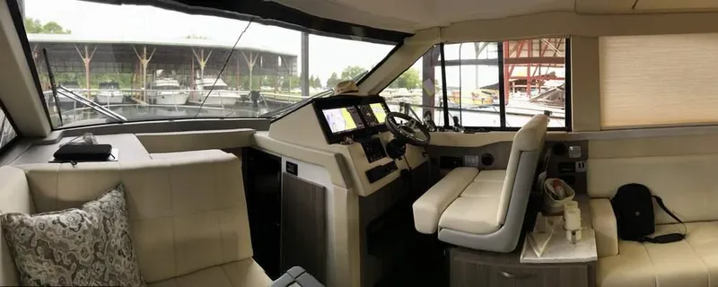  Yacht Photos Pics Interior of 2021 Regal 38 Grande Coupe yacht with modern helm and seating area.