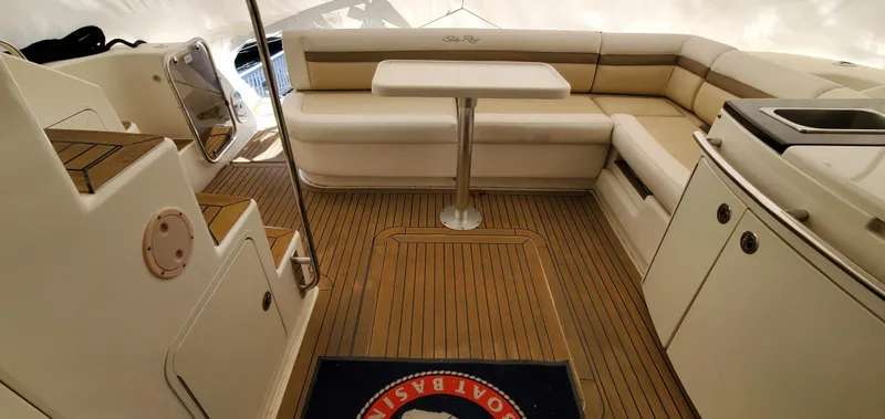 Never Again Yacht Photos Pics 2012 Sea Ray 450 Sedan Bridge interior with seating, table, and kitchenette.