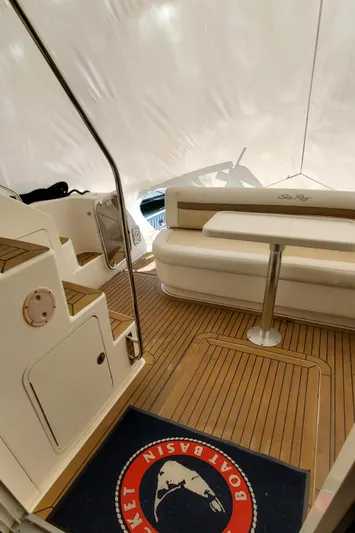 Never Again Yacht Photos Pics 2012 Sea Ray 450 Sedan Bridge interior with wooden flooring and seating area.