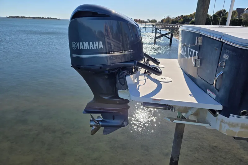  Yacht Photos Pics 2014 Regulator 34 boat with Yamaha outboard motor on calm water.