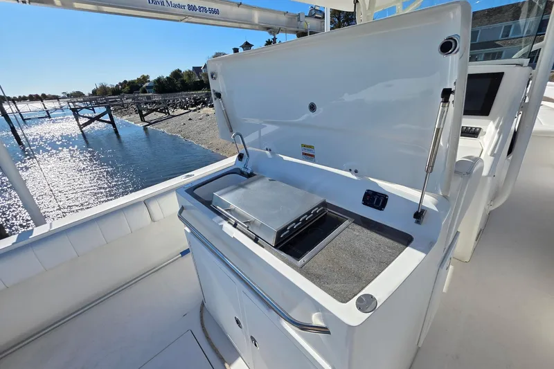  Yacht Photos Pics 2014 Regulator 34 boat with open grill station, dockside view.