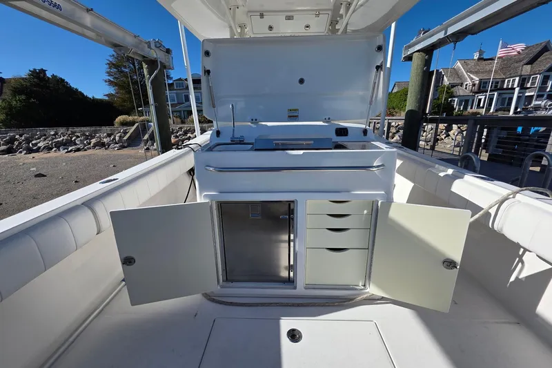  Yacht Photos Pics 2014 Regulator 34 boat interior with open storage compartments and drawers.