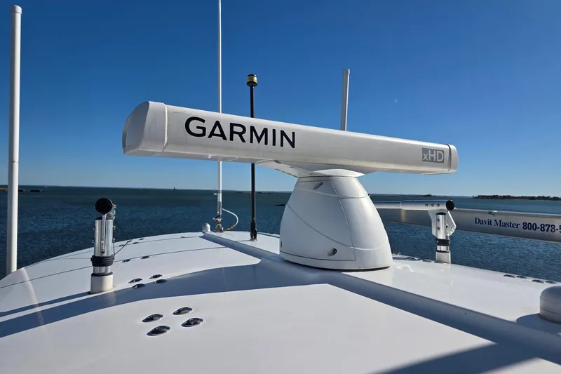  Yacht Photos Pics 2014 Regulator 34 boat with Garmin xHD radar on the deck, ocean background.