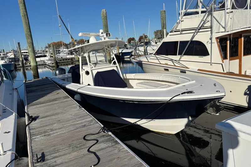  Yacht Photos Pics 2014 Regulator 34 boat docked at marina, clear sky, calm water.