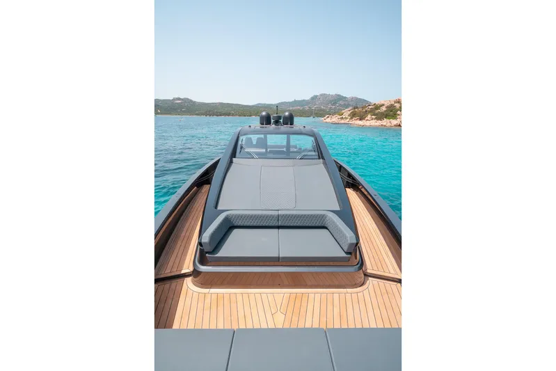 Maori 64 Yacht Photos Pics Maori 64 Yacht 2026 on clear water with wooden deck.