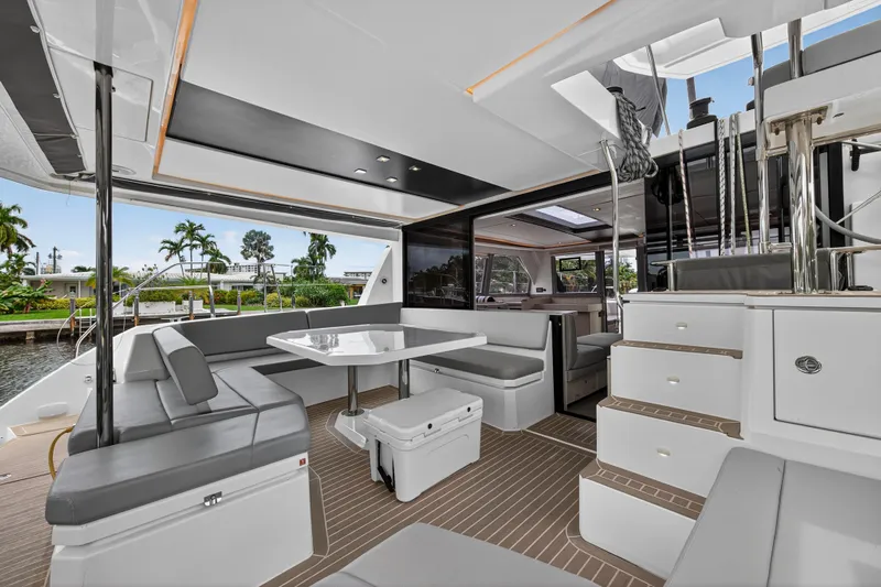 Sundecker Yacht Photos Pics Luxurious 2021 Leopard 45 yacht interior with modern seating and dining area.