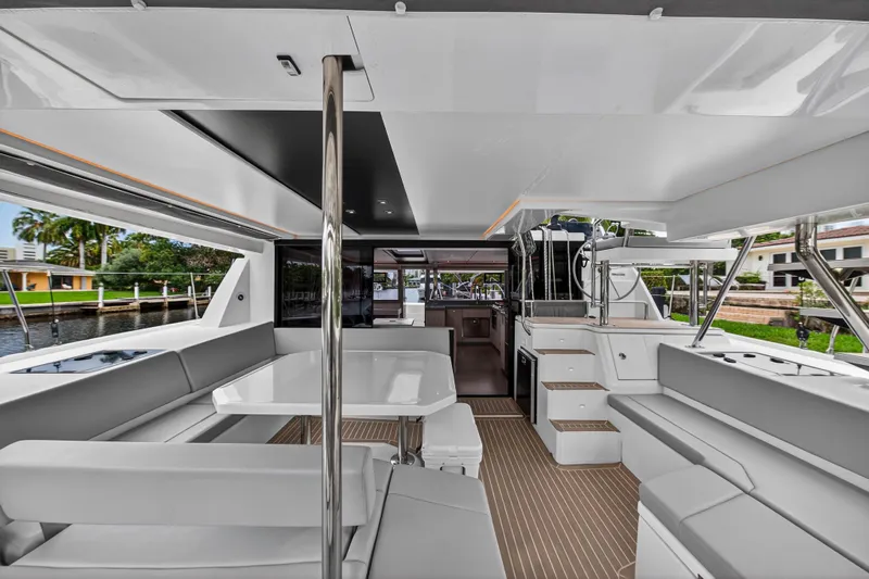 Sundecker Yacht Photos Pics Luxurious 2021 Leopard 45 yacht interior with modern seating and dining area.