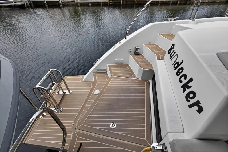 Sundecker Yacht Photos Pics Luxury Leopard 45 yacht deck with steps and water view, 2021 model.