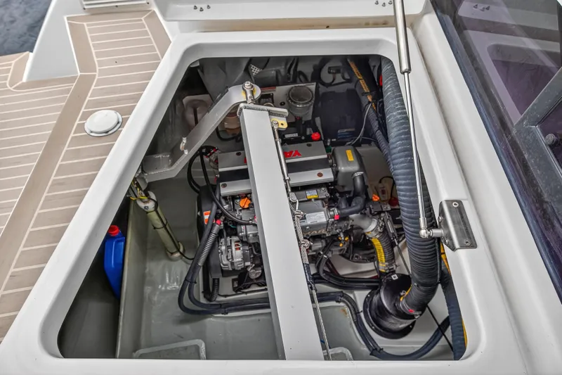 Sundecker Yacht Photos Pics Engine compartment of a 2021 Leopard 45 catamaran, showcasing mechanical components and layout.
